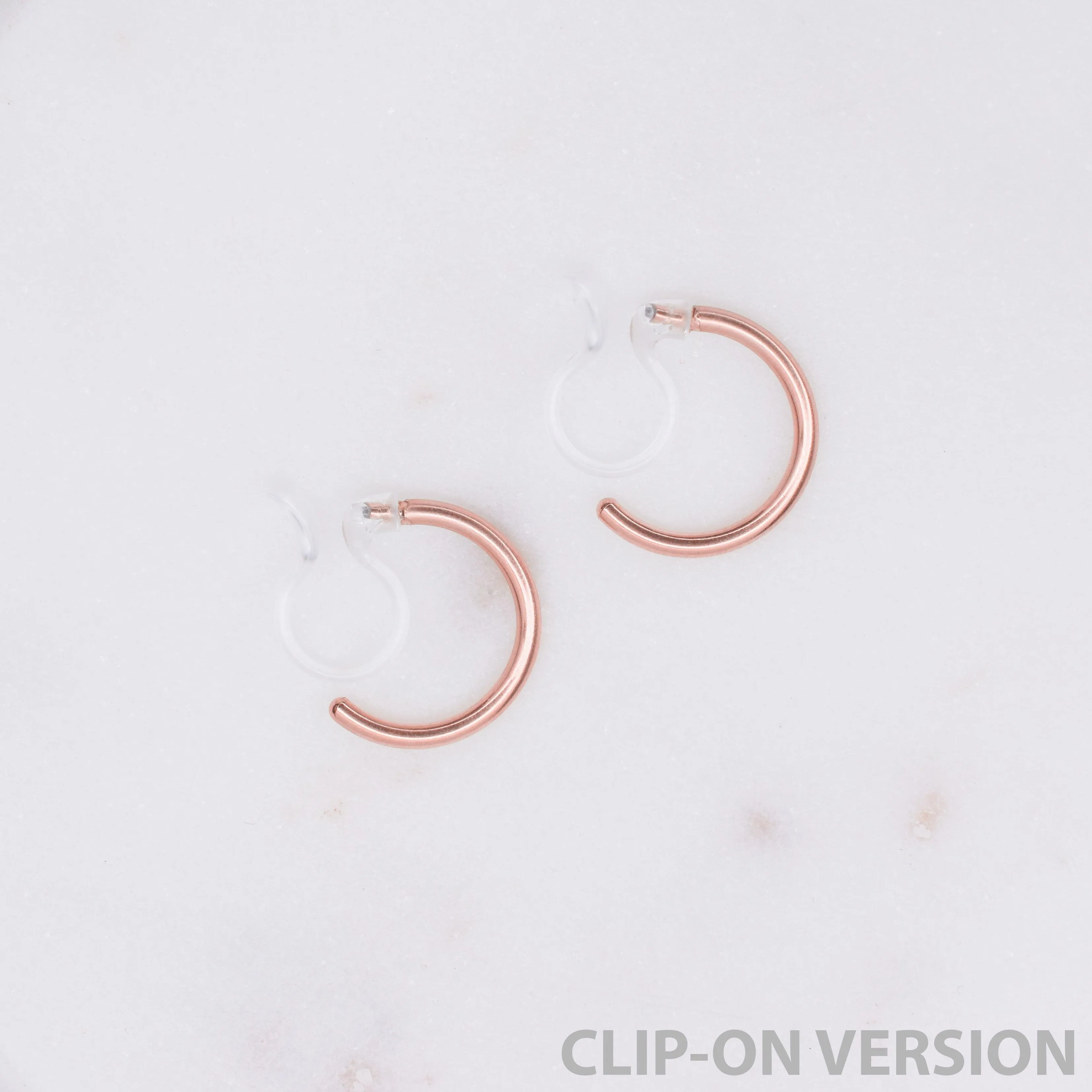 HUGGIE HOOP CLIP-ON EARRINGS IN ROSE GOLD