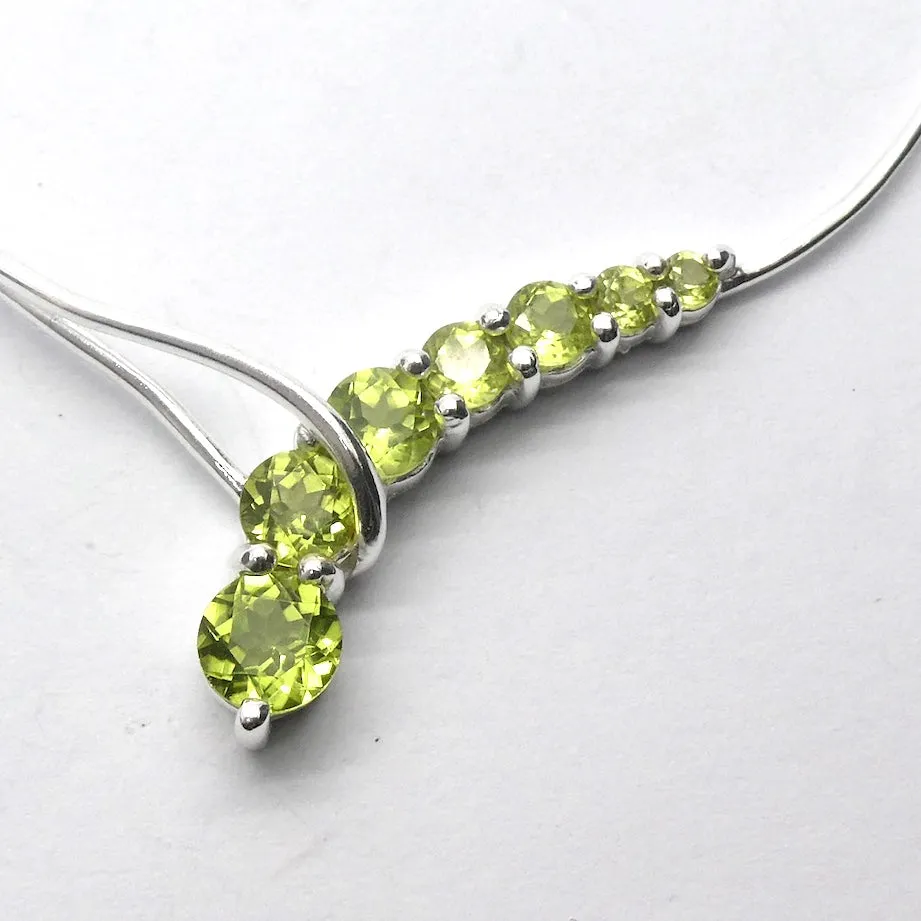 Peridot Necklace, 7 faceted Rounds, Comet, 925 Sterling Silver