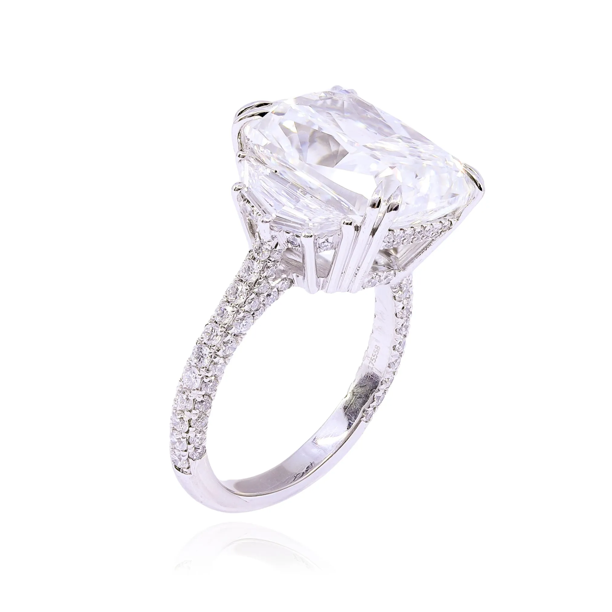 PLATINUM CUSHION-CUT DIAMOND THREE-STONE ENGAGEMENT RING WITH CADILLAC-CUT SIDE DIAMONDS